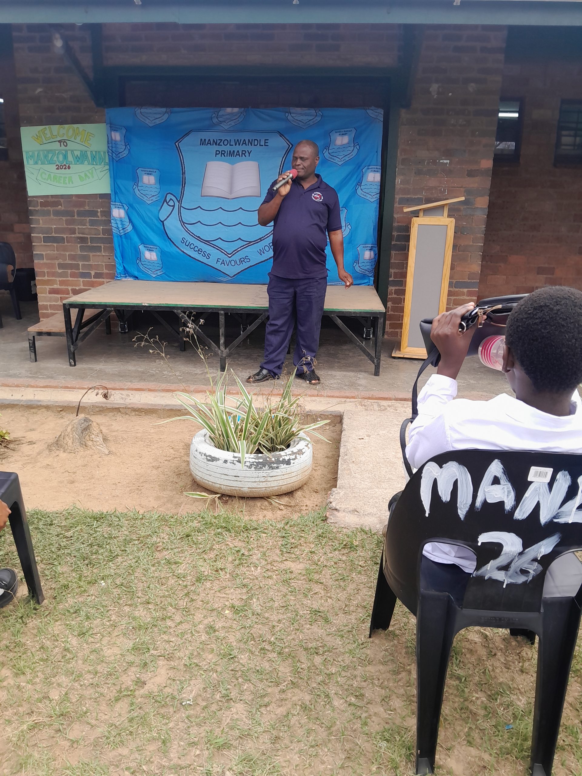 Mr MM Mkhize, plumber, addressing Grade 7 learners